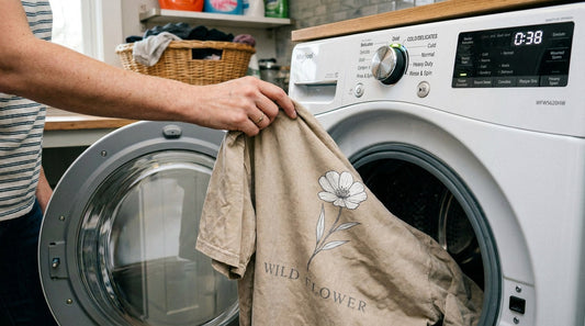 Graphic tee being placed in a washing machine for proper print care